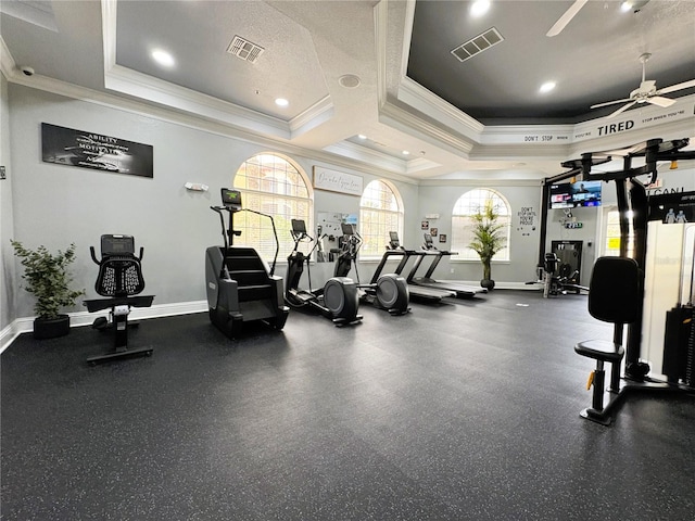 workout area featuring ceiling fan and a textured ceiling