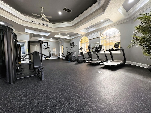 gym with ceiling fan, crown molding, and a towering ceiling