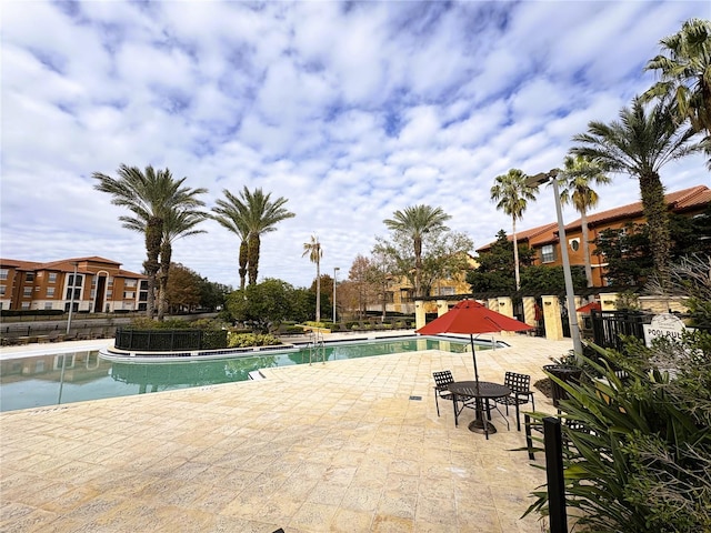 view of swimming pool featuring a patio