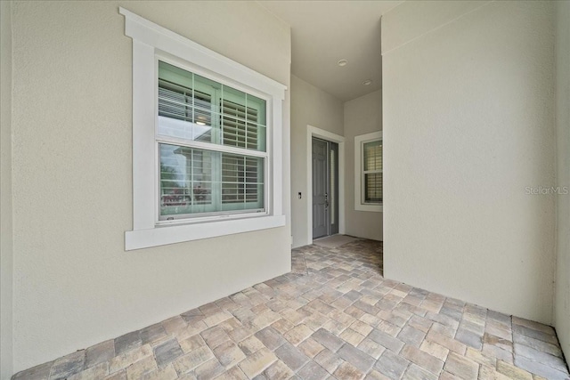 property entrance featuring a patio area