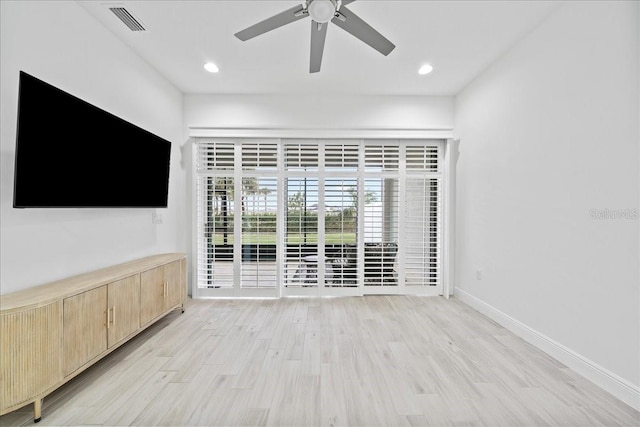 unfurnished living room with ceiling fan and light hardwood / wood-style flooring