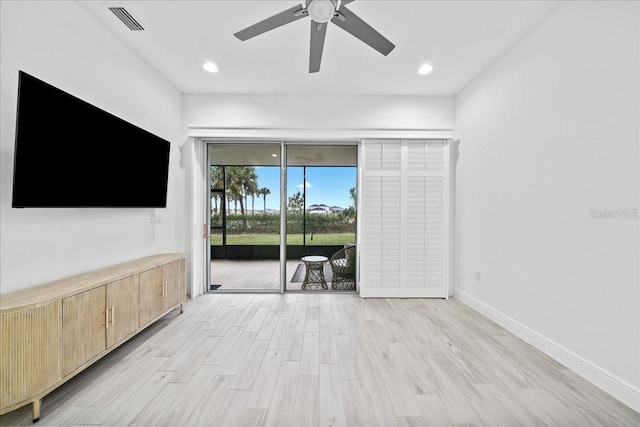 unfurnished living room featuring light hardwood / wood-style floors and ceiling fan