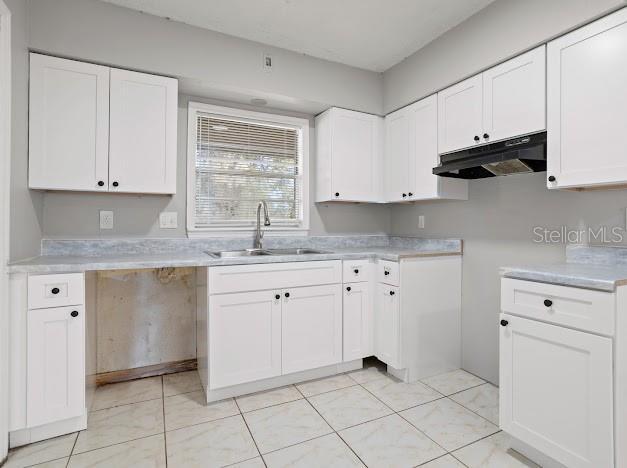 kitchen with sink and white cabinets