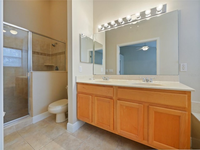 bathroom with toilet, tile patterned floors, vanity, and a shower with shower door