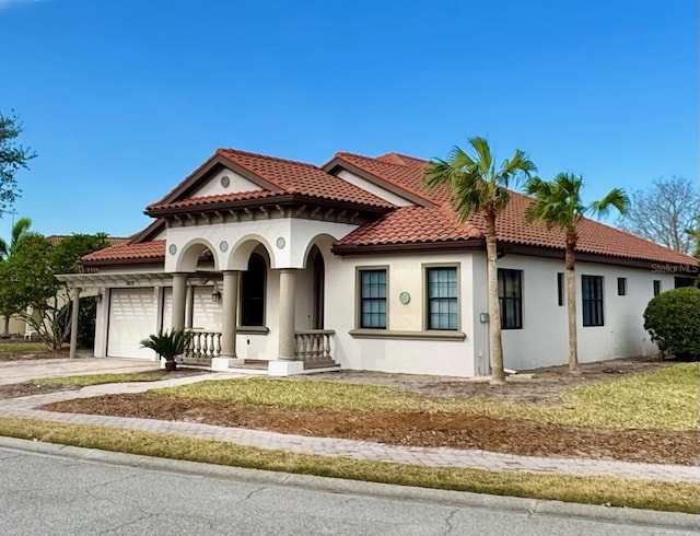 mediterranean / spanish-style house featuring a garage