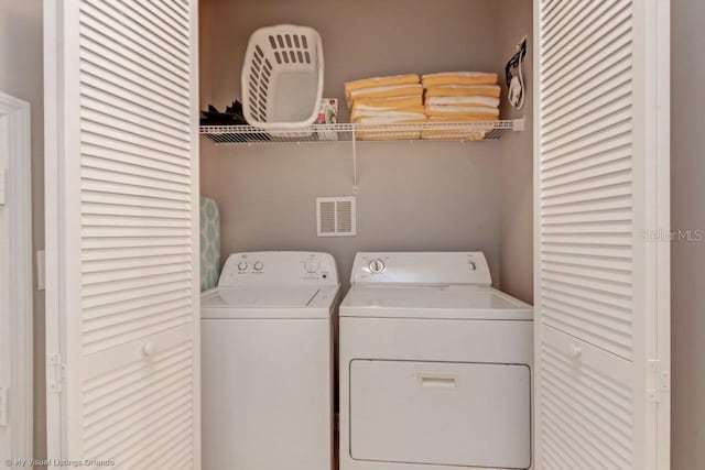 laundry room with separate washer and dryer