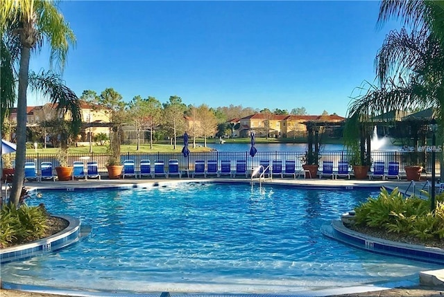 view of pool featuring a water view