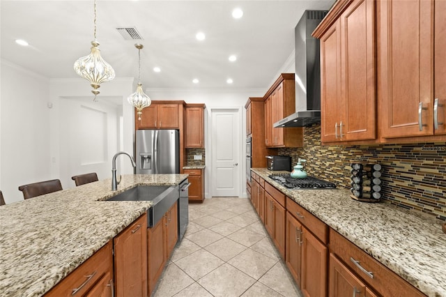 kitchen with appliances with stainless steel finishes, wall chimney exhaust hood, an inviting chandelier, a kitchen breakfast bar, and hanging light fixtures