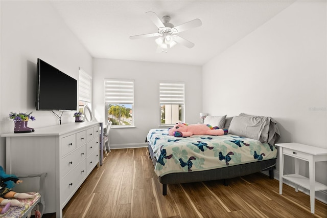 bedroom with ceiling fan and light hardwood / wood-style flooring