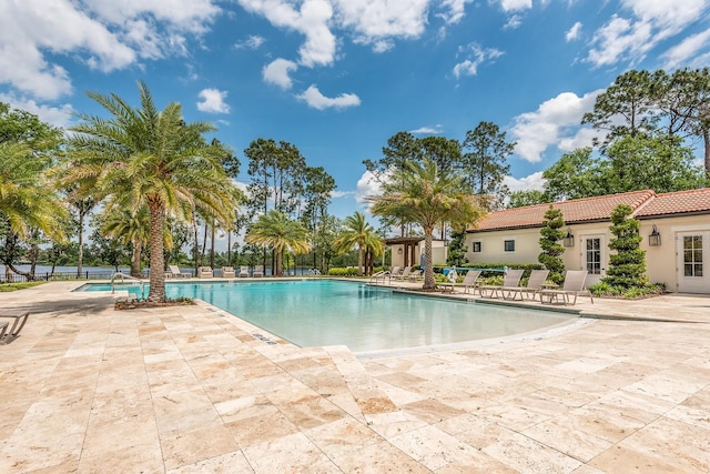 view of swimming pool featuring a patio area