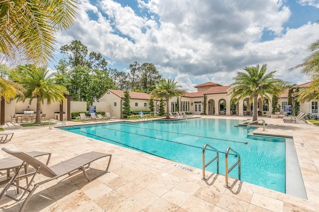 view of pool featuring a patio area