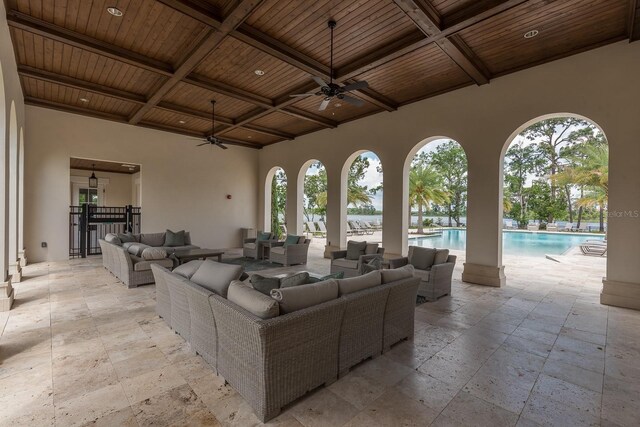 view of patio / terrace featuring an outdoor pool, ceiling fan, and an outdoor living space