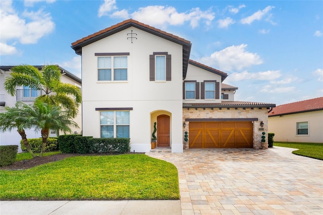 10824 Royal Cypress Way, Orlando, FL 32836 - mediterranean / spanish-style house featuring a tile roof, stone siding, decorative driveway, stucco siding, and a front yard