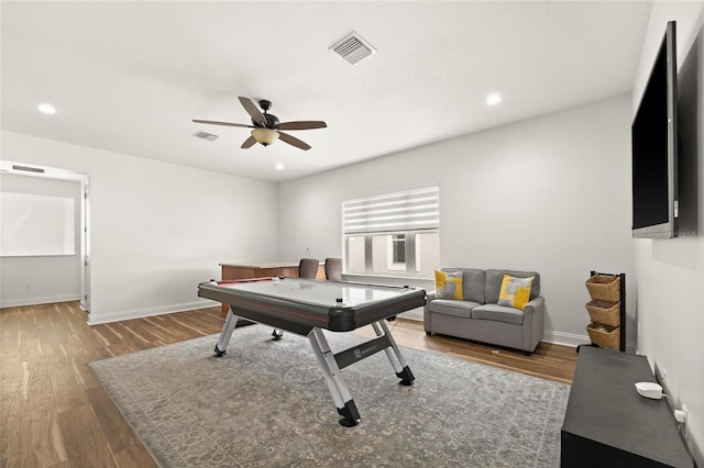 playroom featuring baseboards, visible vents, wood finished floors, and recessed lighting