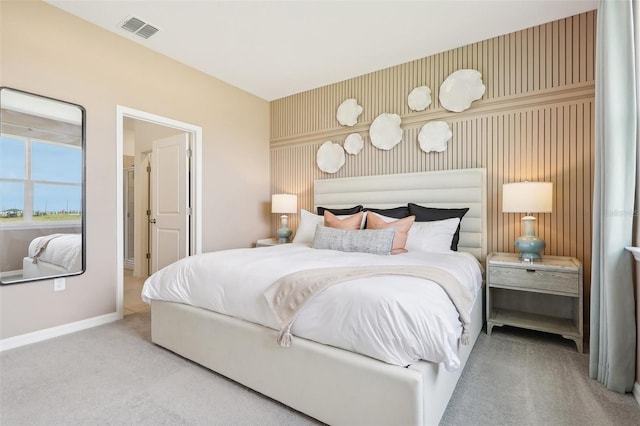 bedroom featuring light carpet