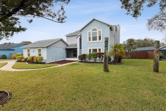 front facade featuring a front yard