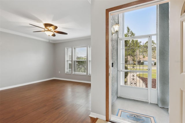 doorway to outside featuring crown molding, ceiling fan, and hardwood / wood-style flooring