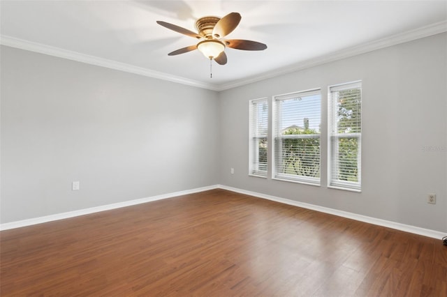 unfurnished room featuring ornamental molding, dark wood-type flooring, and ceiling fan