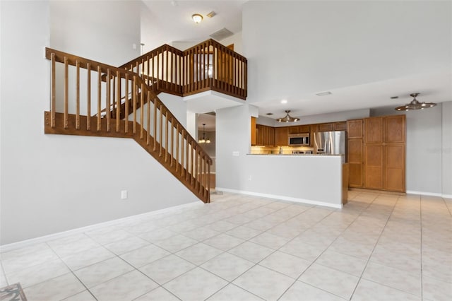 unfurnished living room with light tile patterned floors