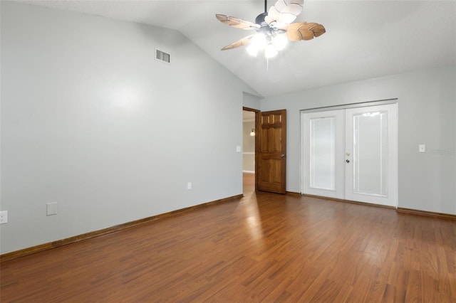 unfurnished bedroom featuring lofted ceiling, hardwood / wood-style flooring, ceiling fan, french doors, and a closet