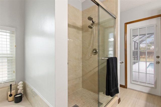 bathroom with a shower with door