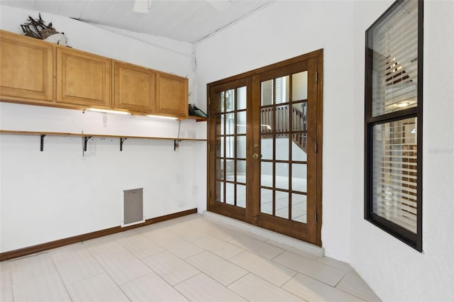 interior space with a kitchen breakfast bar and french doors