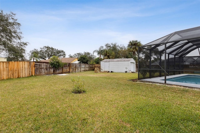 view of yard featuring a storage shed and a lanai