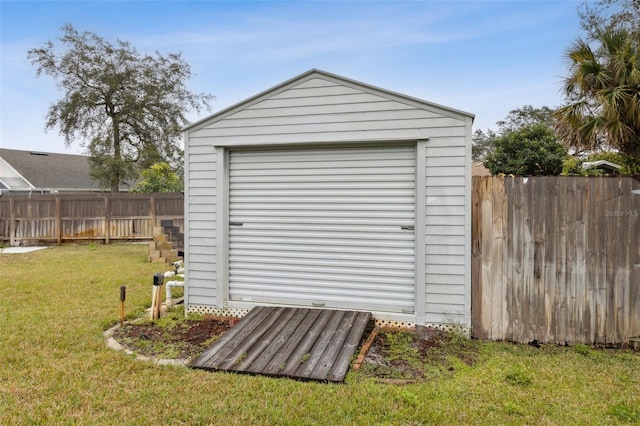 view of outbuilding featuring a yard