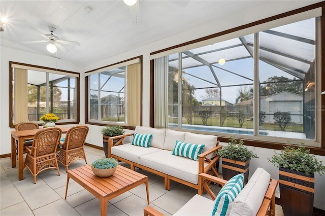 sunroom / solarium featuring ceiling fan and vaulted ceiling