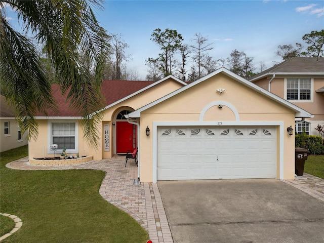 view of front of property with a front lawn and a garage