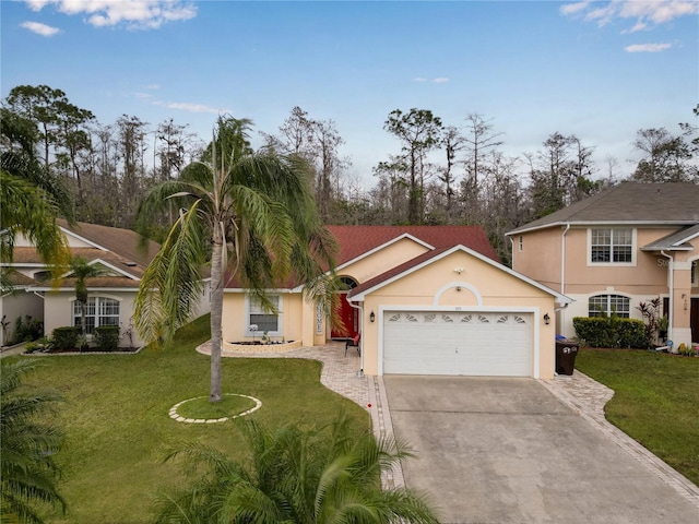 view of front of property with a front lawn and a garage