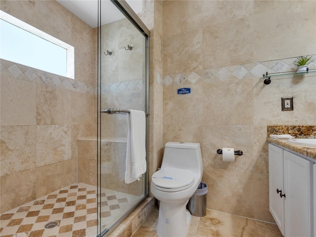 bathroom with toilet, a shower with door, tile walls, and vanity