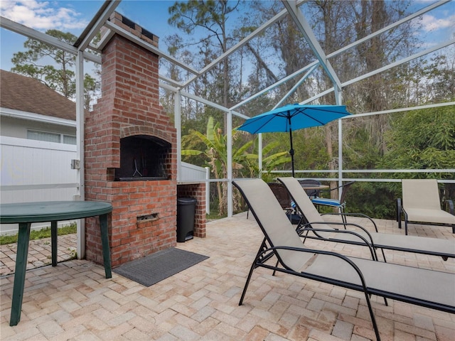 view of patio with a fireplace