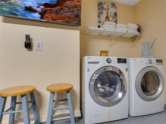 laundry area with separate washer and dryer