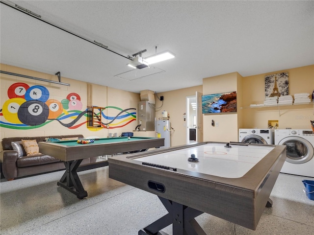 game room featuring billiards, washing machine and dryer, a textured ceiling, and electric water heater