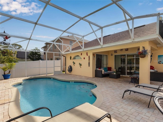 view of pool featuring a lanai, a patio, and outdoor lounge area