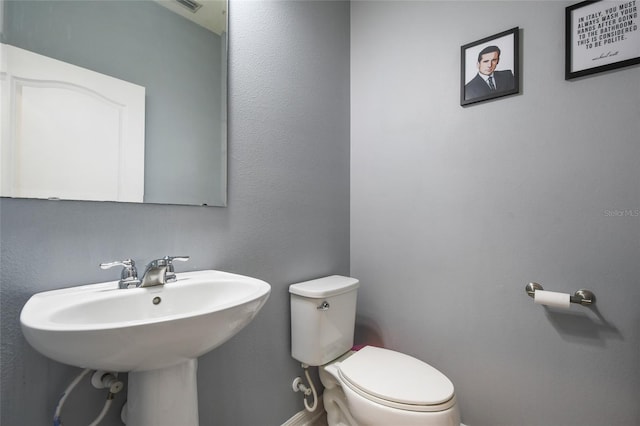 bathroom with toilet and sink