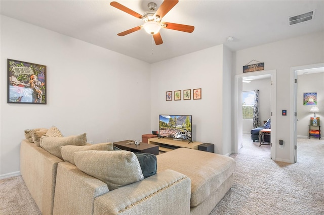 carpeted living room featuring ceiling fan