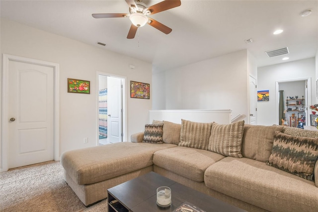 living room featuring ceiling fan and light carpet