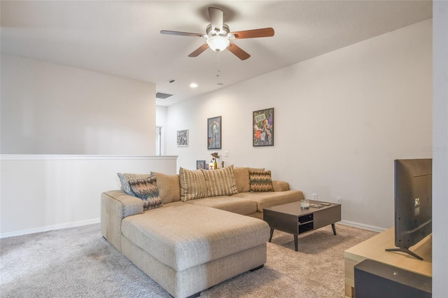 living room featuring light carpet and ceiling fan