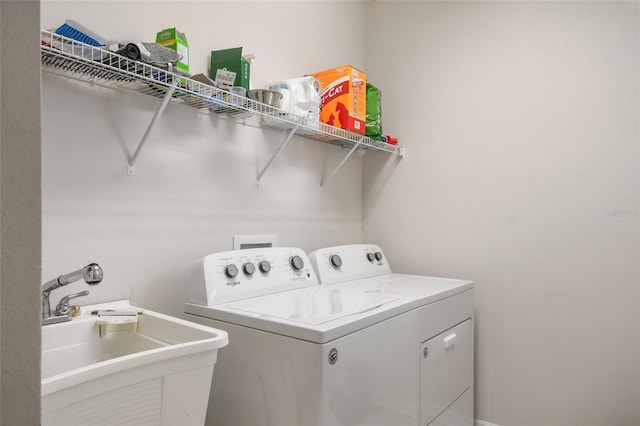 laundry room with sink and separate washer and dryer