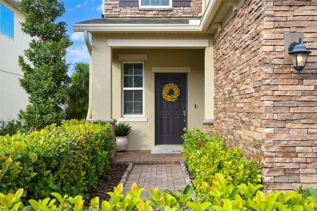 1416 Cabot Dr, Clermont, FL 34711 - view of exterior entry with stucco siding