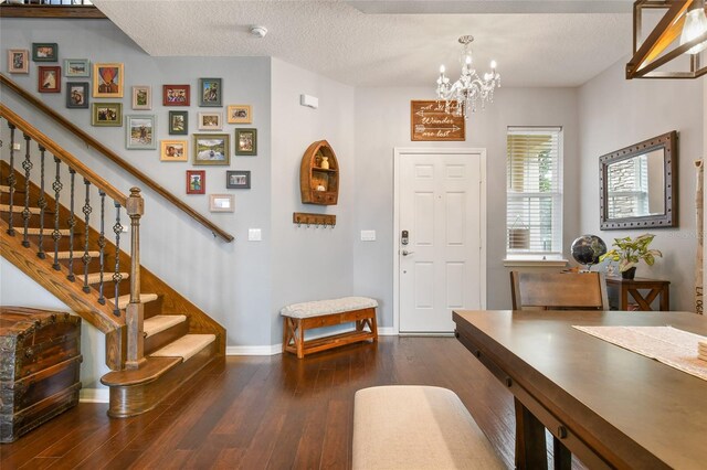 1416 Cabot Dr, Clermont, FL 34711 - foyer featuring wood-type flooring, stairs, and a notable chandelier