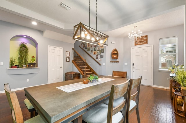 1416 Cabot Dr, Clermont, FL 34711 - dining space with visible vents, a chandelier, baseboards, stairway, and dark wood-type flooring