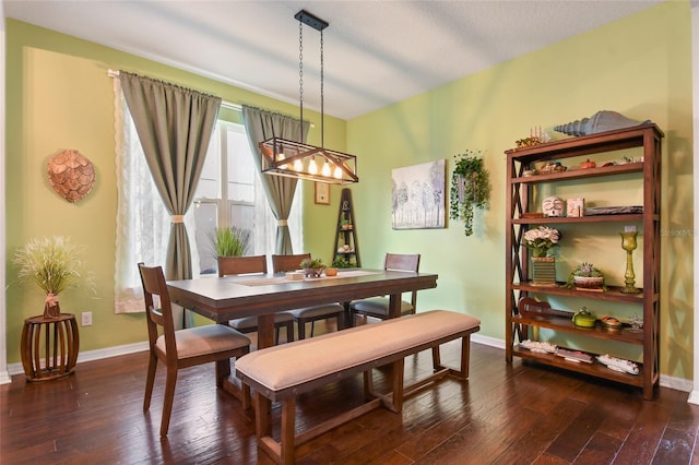 1416 Cabot Dr, Clermont, FL 34711 - dining room featuring dark wood finished floors, an inviting chandelier, and baseboards