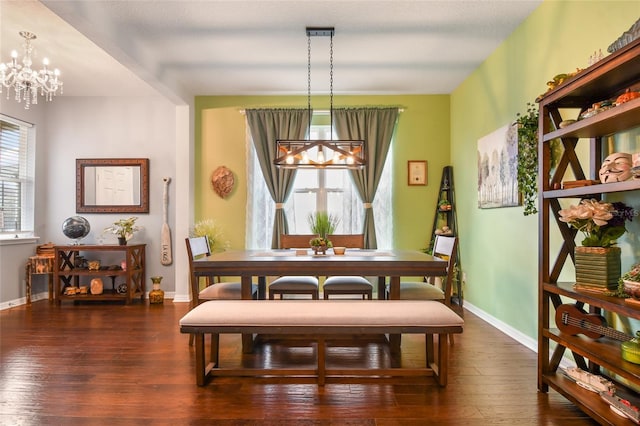 1416 Cabot Dr, Clermont, FL 34711 - dining area featuring a chandelier, baseboards, and wood-type flooring