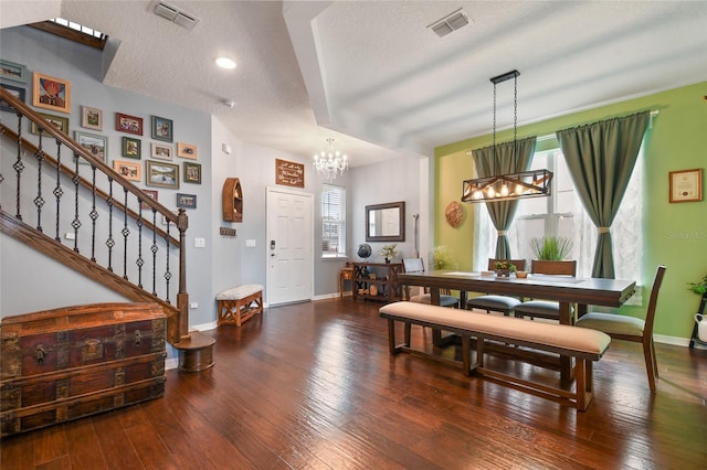 1416 Cabot Dr, Clermont, FL 34711 - dining area with a chandelier, visible vents, stairs, and wood-type flooring