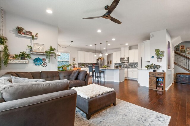 1416 Cabot Dr, Clermont, FL 34711 - living area featuring recessed lighting, ceiling fan, stairs, arched walkways, and dark wood finished floors
