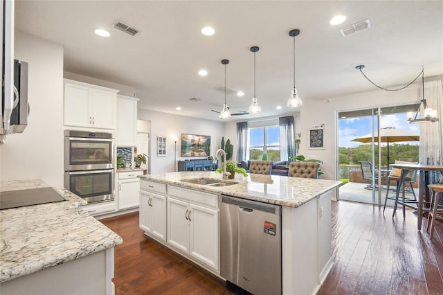 1416 Cabot Dr, Clermont, FL 34711 - kitchen featuring appliances with stainless steel finishes, visible vents, recessed lighting, and a sink