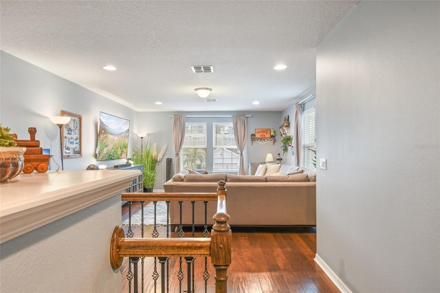 1416 Cabot Dr, Clermont, FL 34711 - living room featuring baseboards, visible vents, hardwood / wood-style flooring, and recessed lighting
